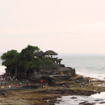 24 Photos That Will Inspire You to Travel the World NOW -- The holy sight in Bali where visitors come for a blessing at Tanah Lot #photograph #travel #wanderlust | CameraAndCarryOn.com