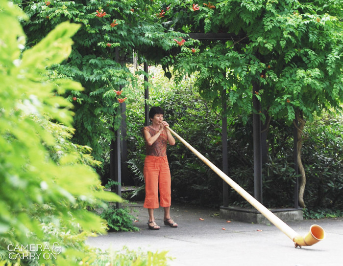 24 Photos That Will Inspire You to Travel the World NOW -- Ricola! She plays the horn high in the rose garden above Bern, Switzerland #photograph #travel #wanderlust | CameraAndCarryOn.com