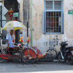24 Photos That Will Inspire You to Travel the World NOW -- City street with lots to see like this old gent and bicycle in Penang, Malaysia #photograph #travel #wanderlust | CameraAndCarryOn.com