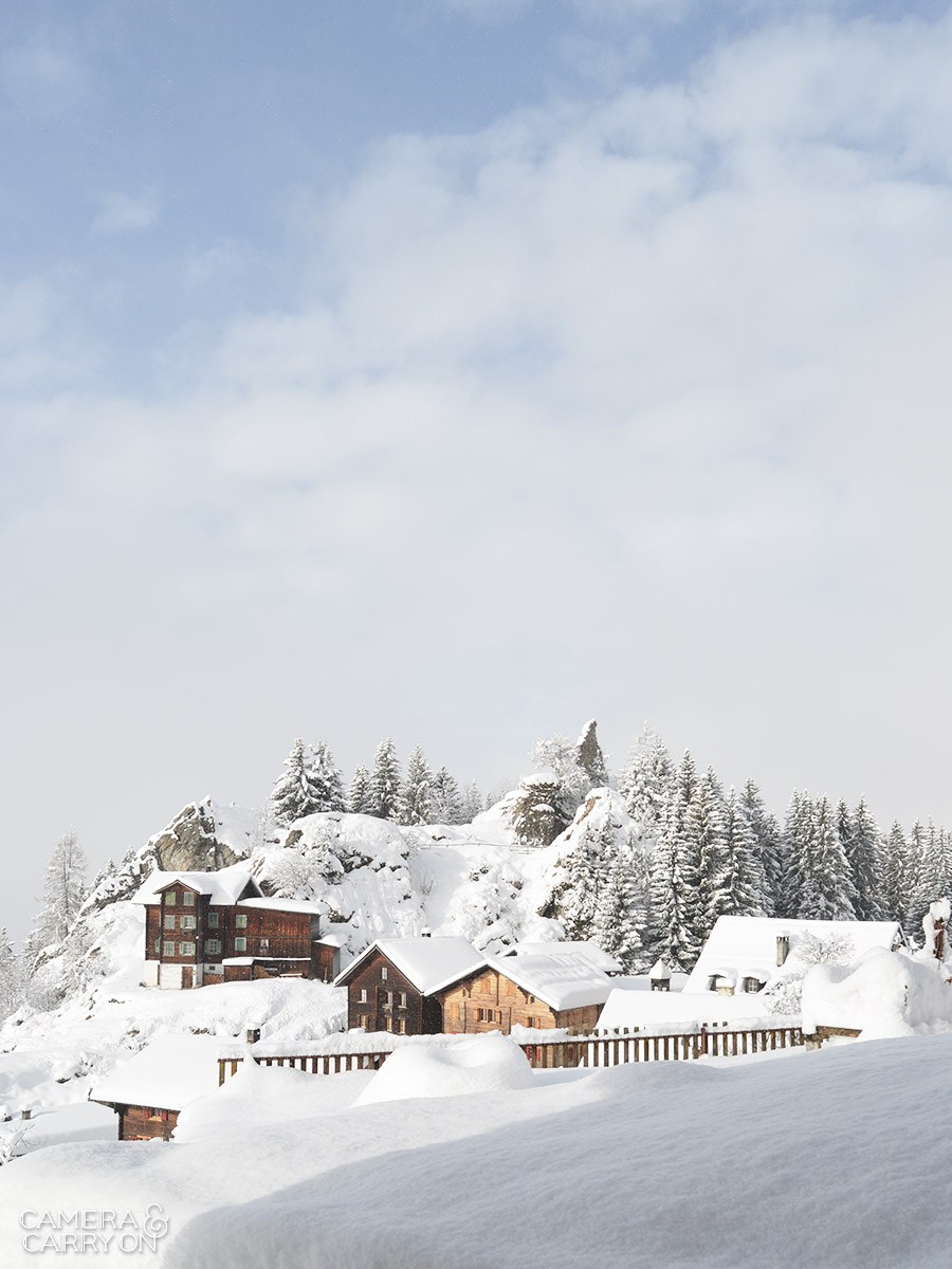 24 Photos That Will Inspire You to Travel the World NOW — The mountainside town of Siat, Switzerland, covered in snow #photograph #travel #wanderlust | CameraAndCarryOn.com